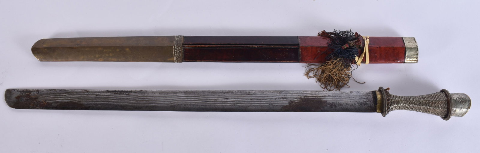 AN 18TH/19TH CENTURY TIBETAN SWORD with silver mounts and scabbard. 80 cm long.: AN 18TH/19TH CENTURY TIBETAN SWORD with silver mounts and scabbard. 80 cm long.