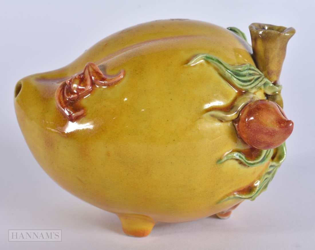 A CHINESE YELLOW GLAZED POTTERY FRUIT. 12 cm wide. (1 of 5)