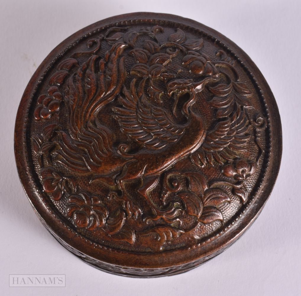A CHINESE BRONZE BOX AND COVER. 8.5 cm diameter.: A CHINESE BRONZE BOX AND COVER. 8.5 cm diameter.