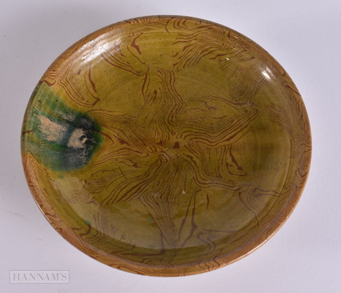 A CHINESE MARBLEISED POTTERY DISH. 12.5 cm wide. (1 of 3)