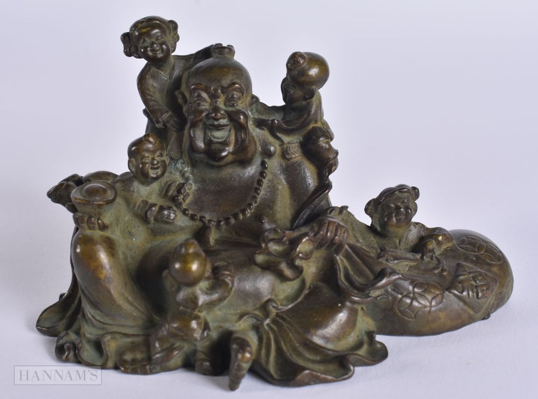 A CHINESE BRONZE BUDDHA. 8 cm x 9 cm.: A CHINESE BRONZE BUDDHA. 8 cm x 9 cm.
