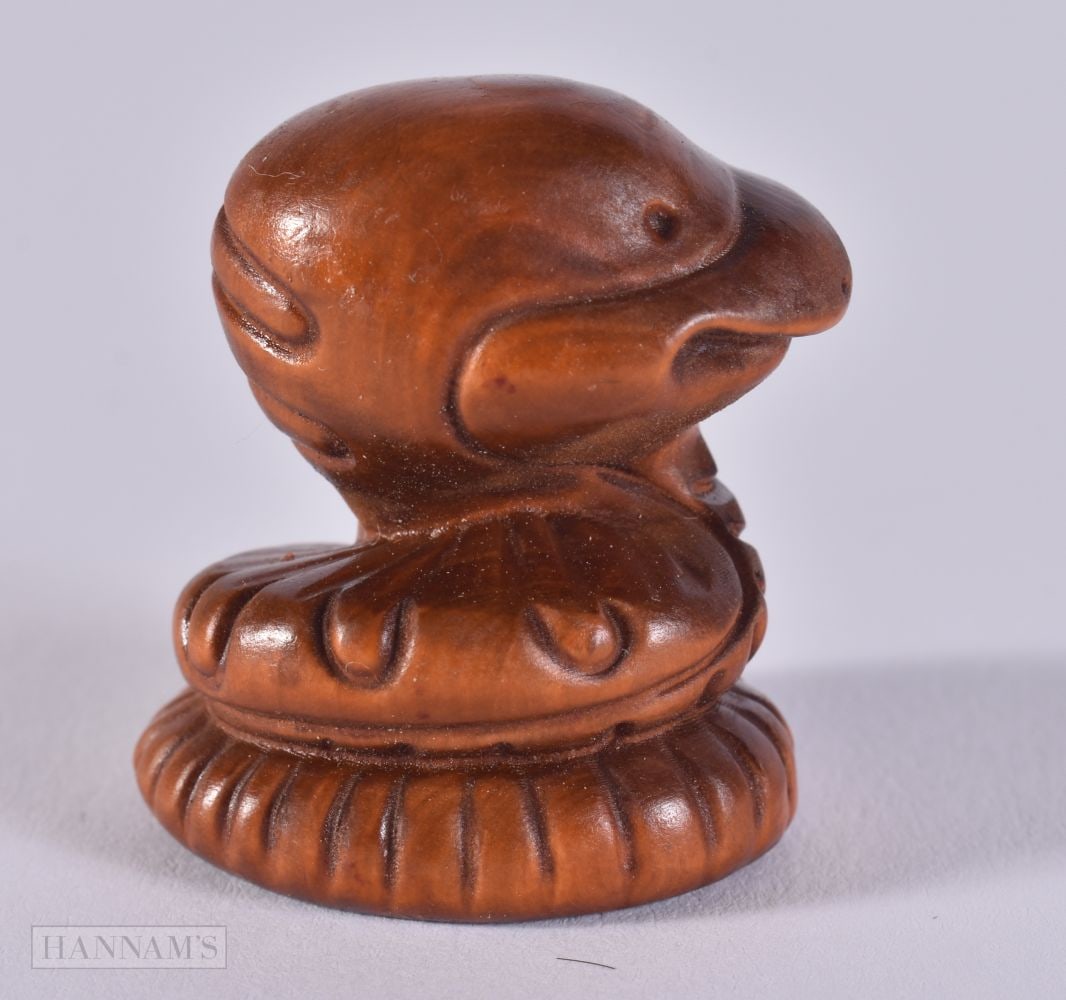 A CARVED WOOD SNAKE. 3.3 x 3.1 x 2.4 cm. (1 of 4)