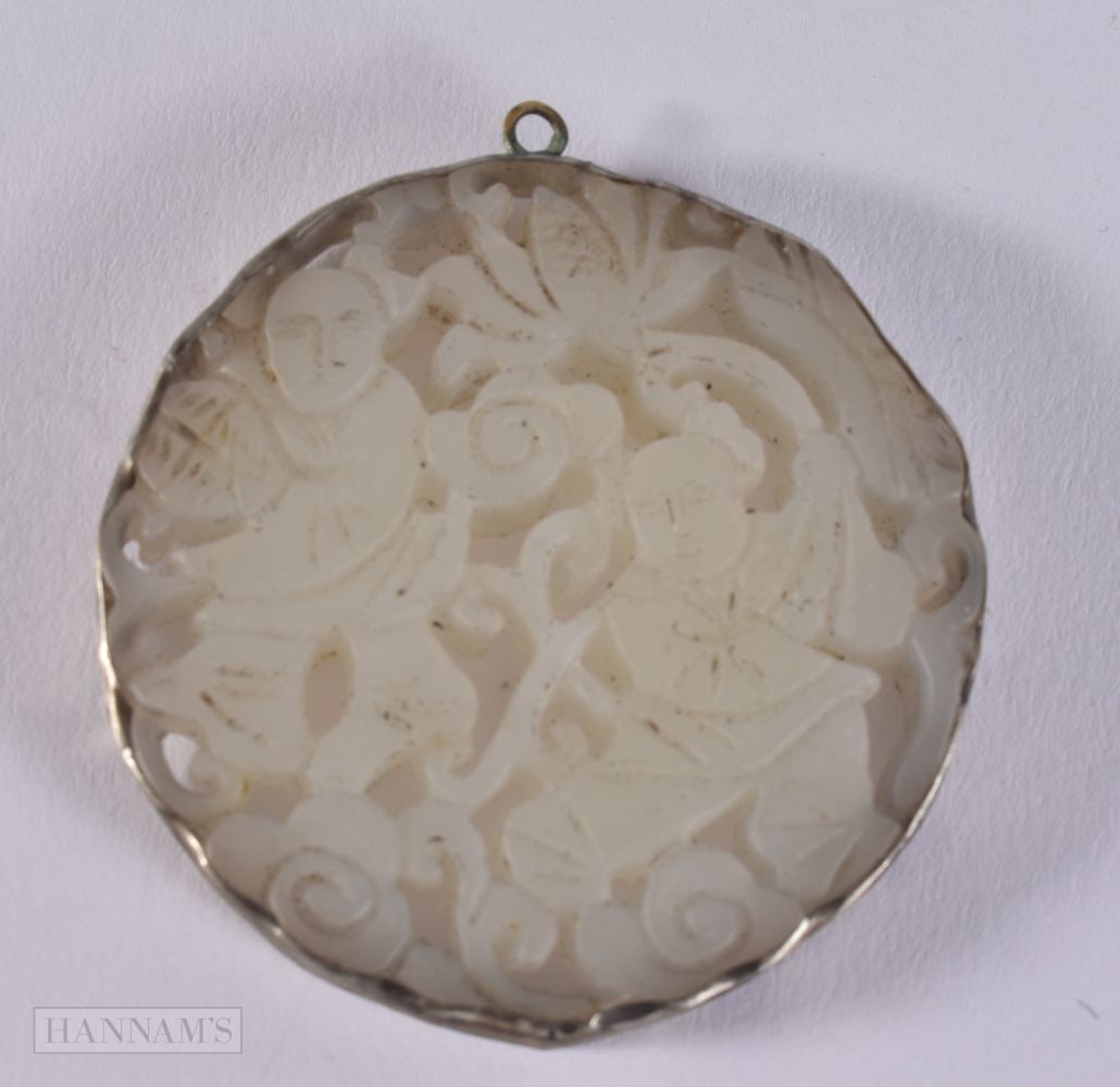 A SILVER MOUNTED JADE PENDANT. 5.1 cm diameter.: A SILVER MOUNTED JADE PENDANT. 5.1 cm diameter.