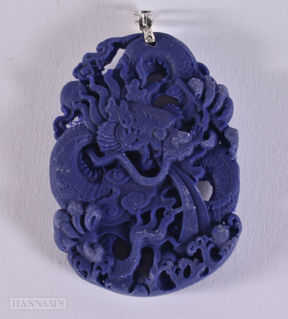 A SILVER TOPPED LAPIS PENDANT. 6.5 x 4 cm.: A SILVER TOPPED LAPIS PENDANT. 6.5 x 4 cm.