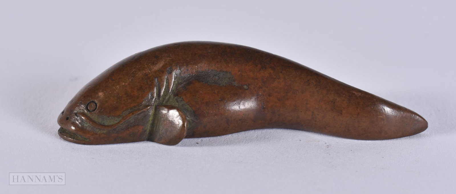 A BRONZE CATFISH. 1.3 x 5.7 x 2.1 cm. (1 of 4)