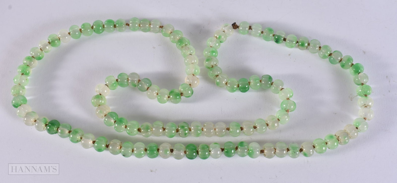 A JADE STRING PUMPKIN BEAD NECKLACE. 106 grams. 88 cm. (1 of 3)