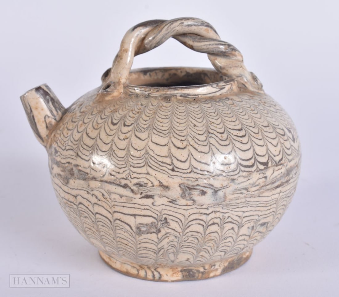 A CHINESE MARBLEISED POTTERY TEAPOT. 11 cm wide. (1 of 5)