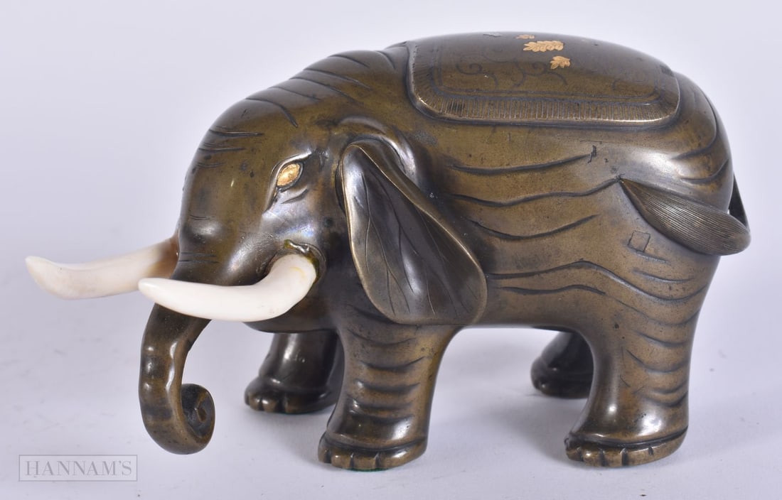 A 19TH CENTURY JAPANESE MEIJI PERIOD GOLD INLAID BRONZE OKIMONO modelled as an elephant. 13.5 cm wid (1 of 5)