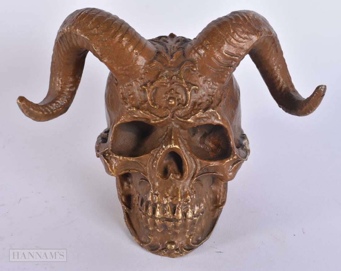 A CHINESE BRONZE SKULL. 12 cm x 14 cm. (1 of 4)