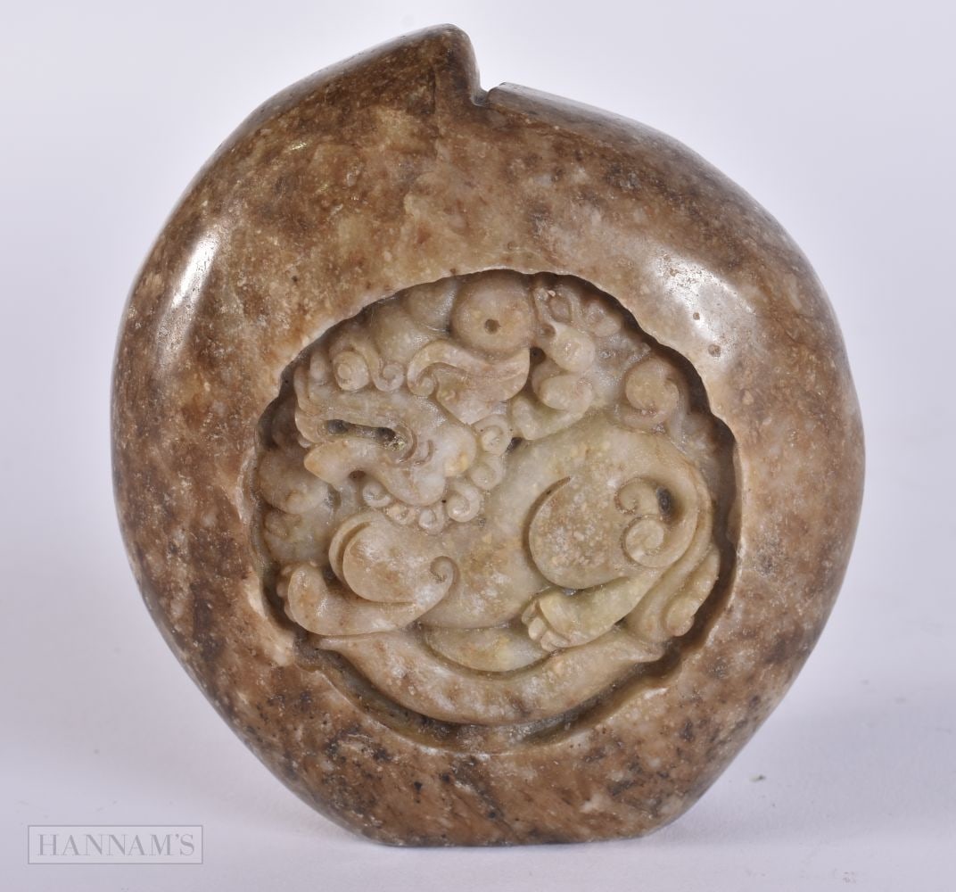 A CHINESE CARVED STONE DRAGON BOULDER. 9 cm x 7.5 cm. (1 of 4)