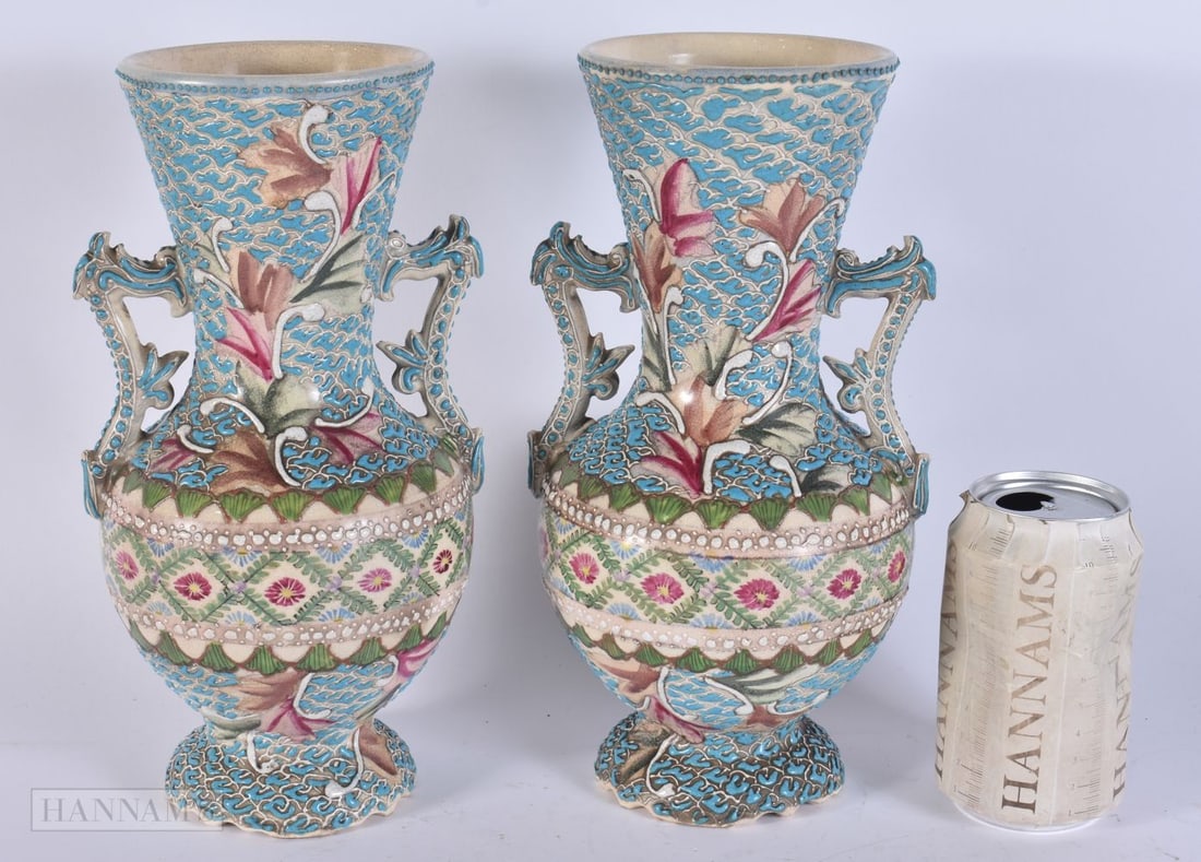 A PAIR OF EARLY 20TH CENTURY JAPANESE MEIJI PERIOD SATSUMA VASES enamelled pin relief with flowers.: A PAIR OF EARLY 20TH CENTURY JAPANESE MEIJI PERIOD SATSUMA VASES enamelled pin relief with flowers. 26.5 cm high.