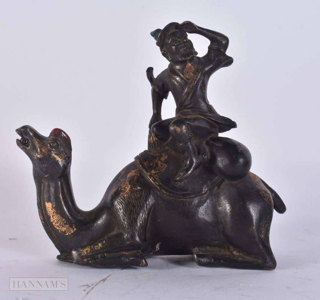 A CHINESE GOLD SPLASH BRONZE CAMEL. 14 cm x 16 cm. (1 of 4)