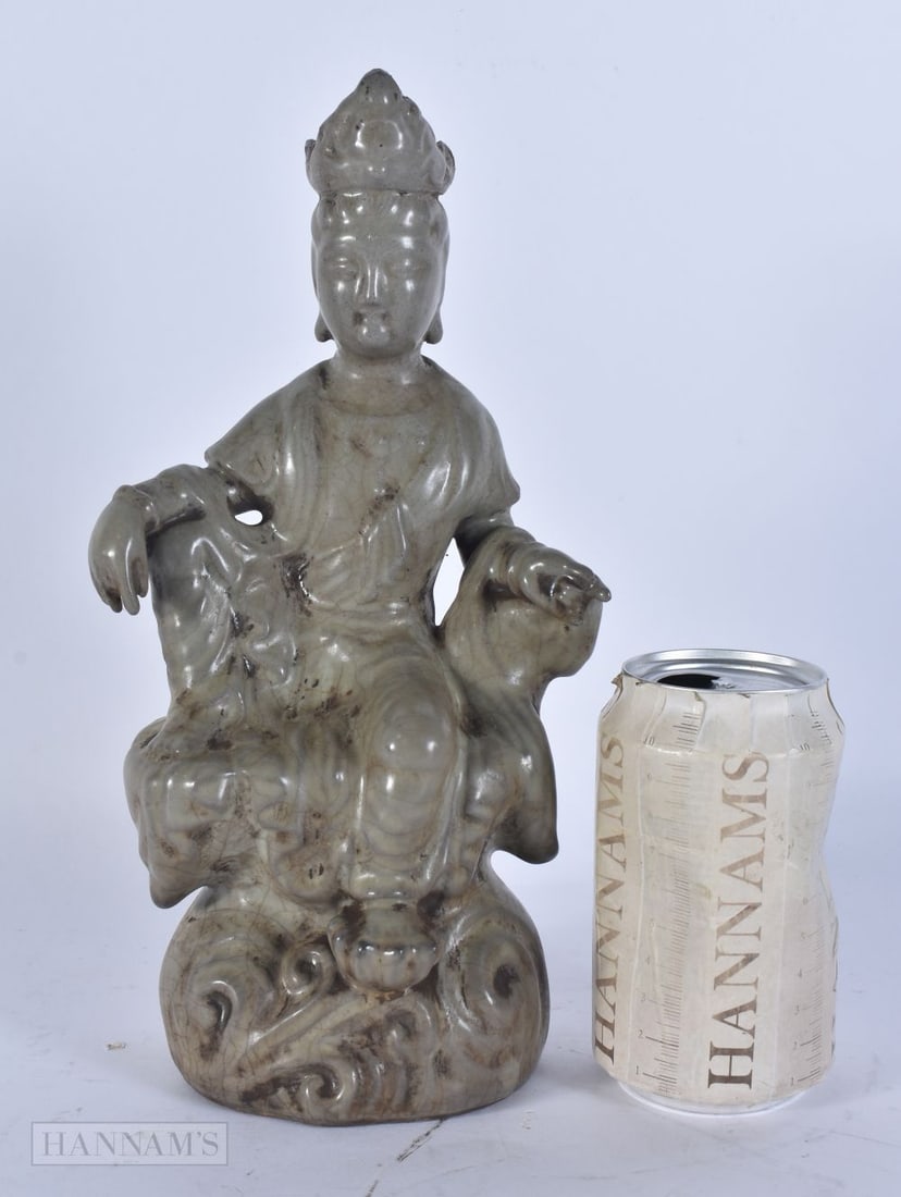 A CHINESE CELADON POTTERY DEITY. 27cm high. (1 of 4)