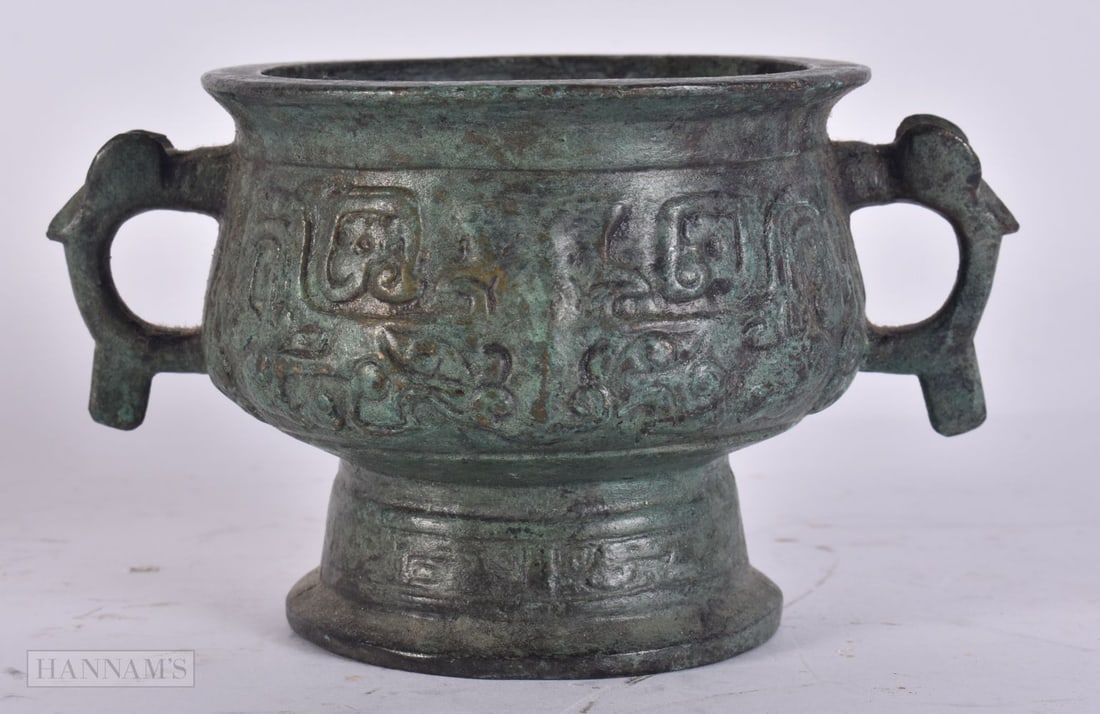 A CHINESE TWIN HANDLED BRONZE CENSER. 14 cm x 8 cm. (1 of 4)
