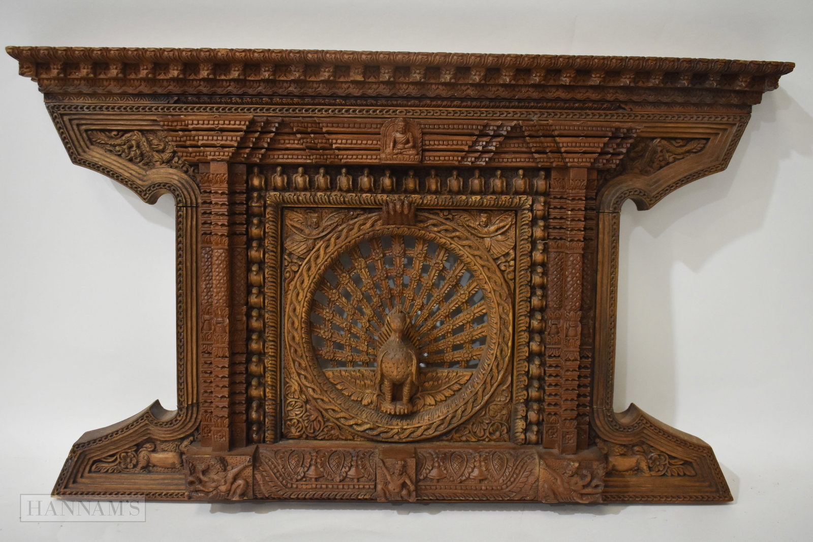 AN INDIAN CARVED WOOD PEACOCK PANEL. 70 cm x 48 cm.: AN INDIAN CARVED WOOD PEACOCK PANEL. 70 cm x 48 cm.