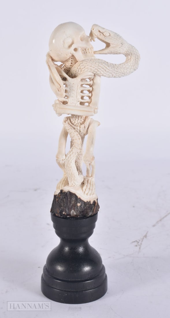 A MEMENTO MORI CARVED STAG ANTLER SKELETON. 15 cm high.: A MEMENTO MORI CARVED STAG ANTLER SKELETON. 15 cm high.