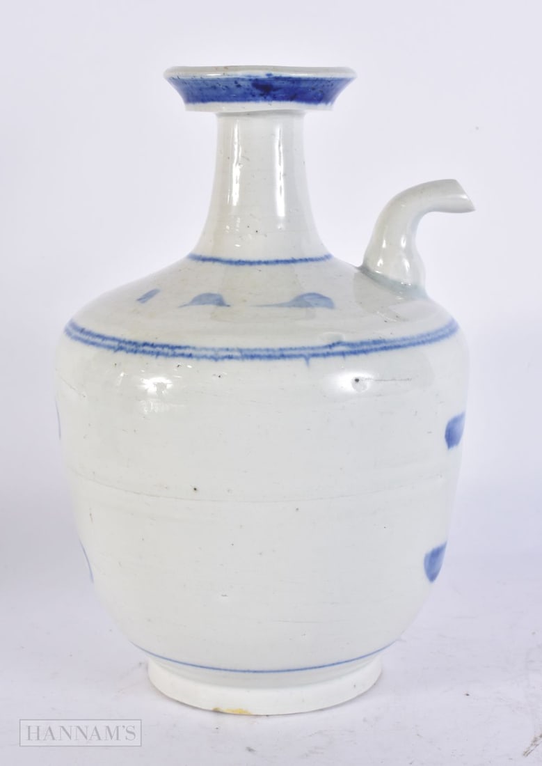 A CHINESE BLUE AND WHITE PORCELAIN KENDI. 23.5 cm high. (1 of 5)