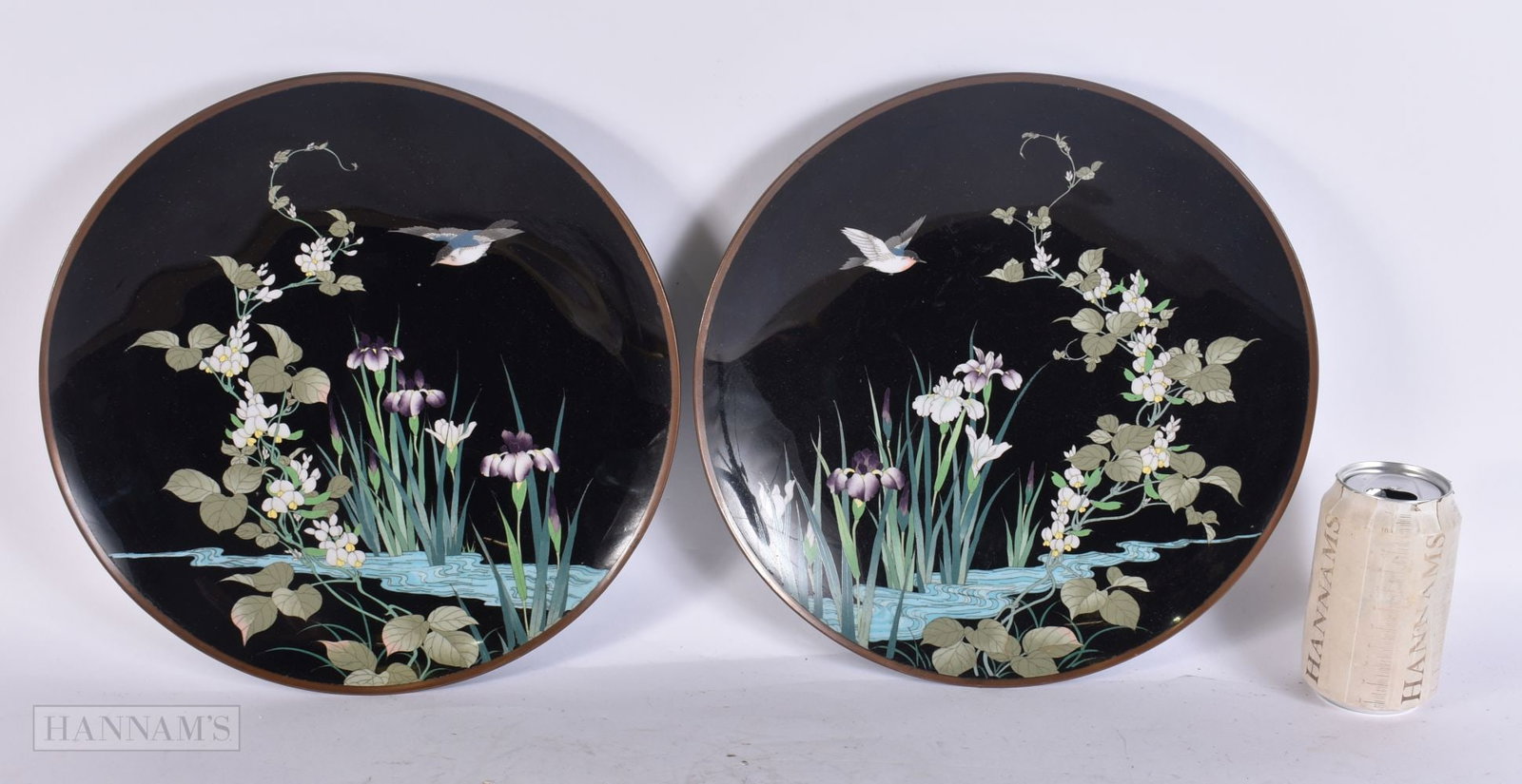 A PAIR OF EARLY 20TH CENTURY JAPANESE MEIJI PERIOD CLOISONNE ENAMEL DISHES decorated with birds in f: A PAIR OF EARLY 20TH CENTURY JAPANESE MEIJI PERIOD CLOISONNE ENAMEL DISHES decorated with birds in flight. 30cm diameter.
