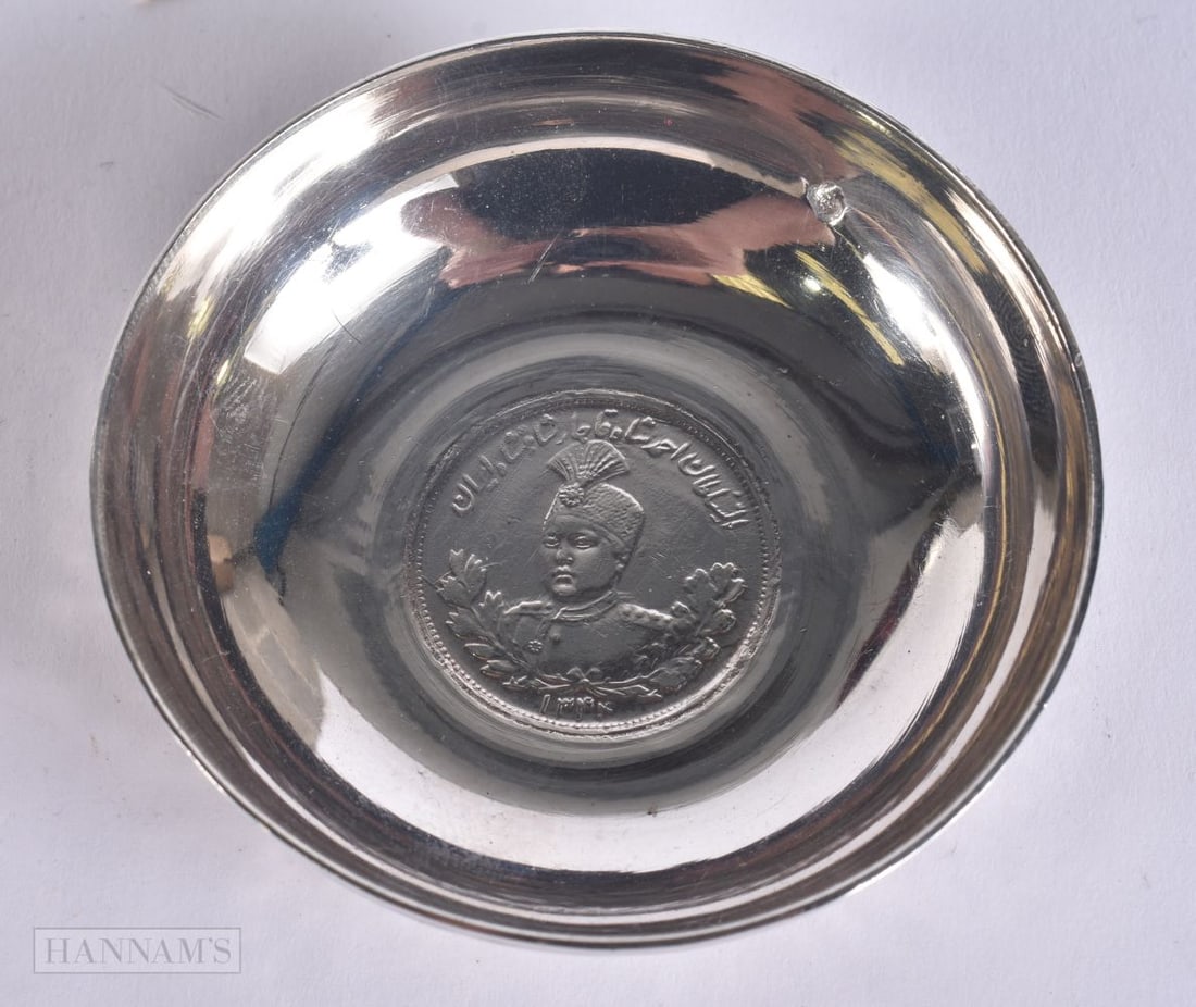 AN ISLAMIC SILVER COIN DISH. 58 grams. 7 cm wide. (1 of 3)