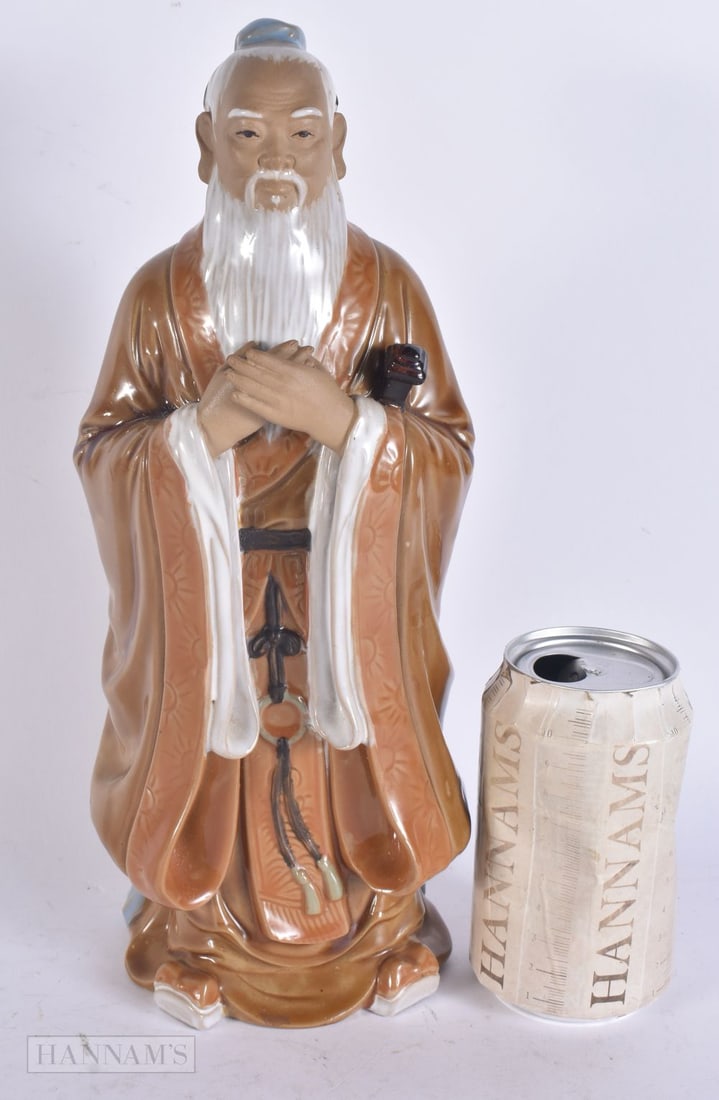 A CHINESE STONEWARE POTTERY FIGURE OF AN IMMORTAL. 30cm high. (1 of 5)