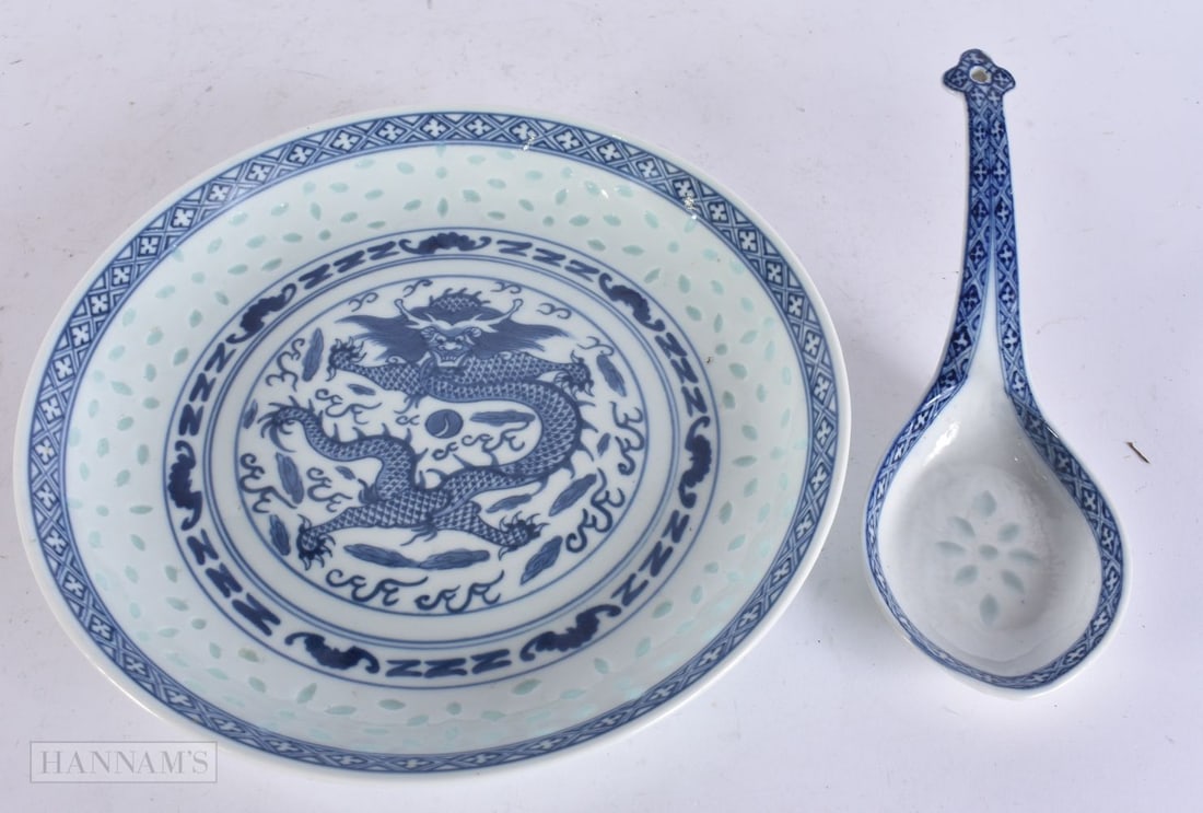 A CHINESE BLUE AND WHITE DRAGON PLATE together with a spoon. 22cm wide. (2) (1 of 5)