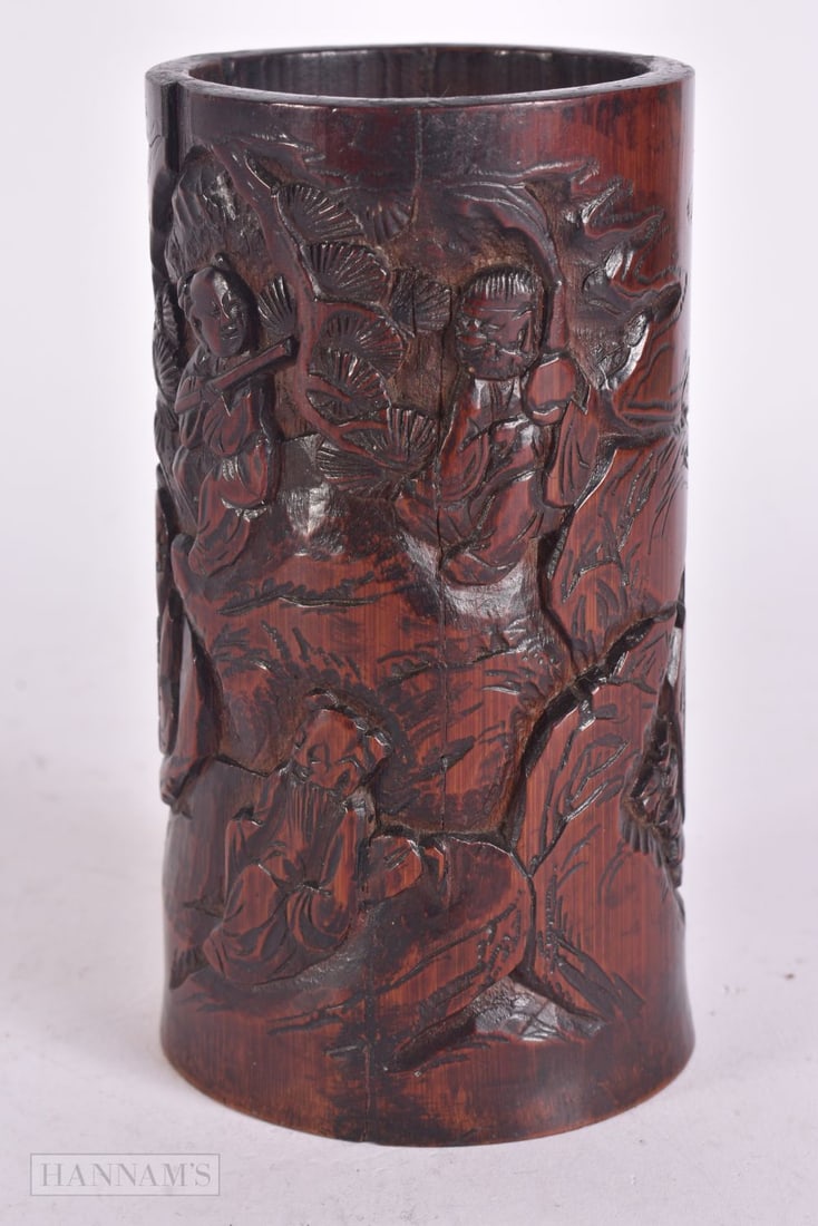 A CHINESE QING DYNASTY CARVED BAMBOO IMMORTALS BRUSH POT. 12.5 cm high.: A CHINESE QING DYNASTY CARVED BAMBOO IMMORTALS BRUSH POT. 12.5 cm high.