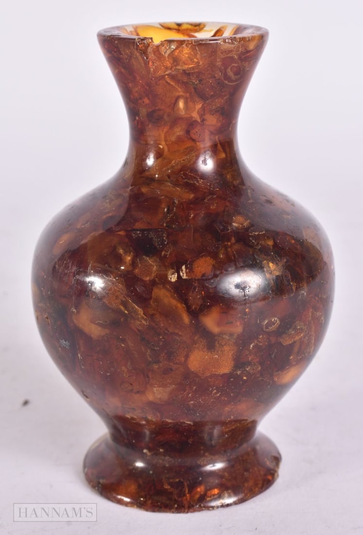 AN UNUSUAL MIDDLE EASTERN AMBER VASE. 143 grams. 11 cm x 5 cm. (1 of 4)