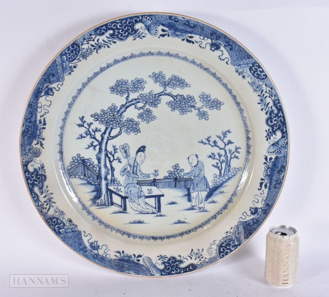 A MONUMENTAL 18TH CENTURY CHINESE EXPORT BLUE AND WHITE DISH Qianlong, painted with two figures in a (1 of 6)