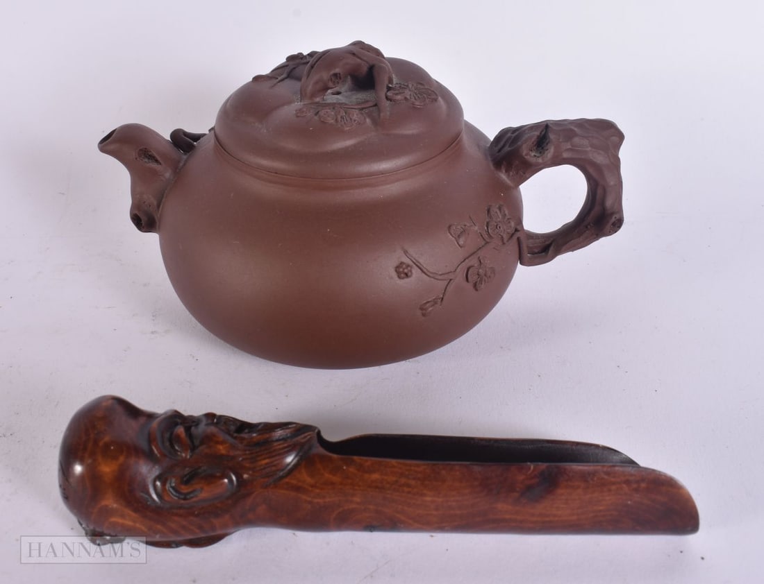 A CHINESE YIXING POTTERY TEAPOT AND COVER together with a scoop. 14 cm wide. (2) (1 of 10)