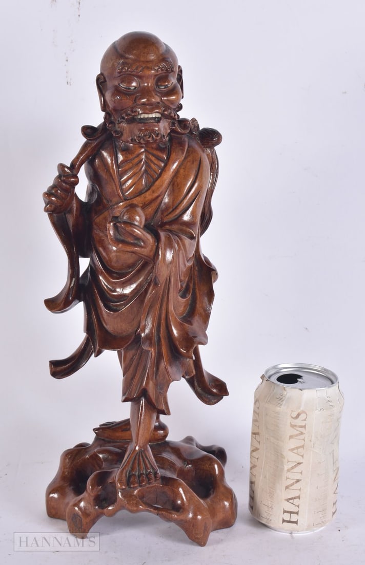 A 19TH CENTURY CHINESE CARVED HARDWOOD IMMORTAL Late Qing. 35 cm high.: A 19TH CENTURY CHINESE CARVED HARDWOOD IMMORTAL Late Qing. 35 cm high.