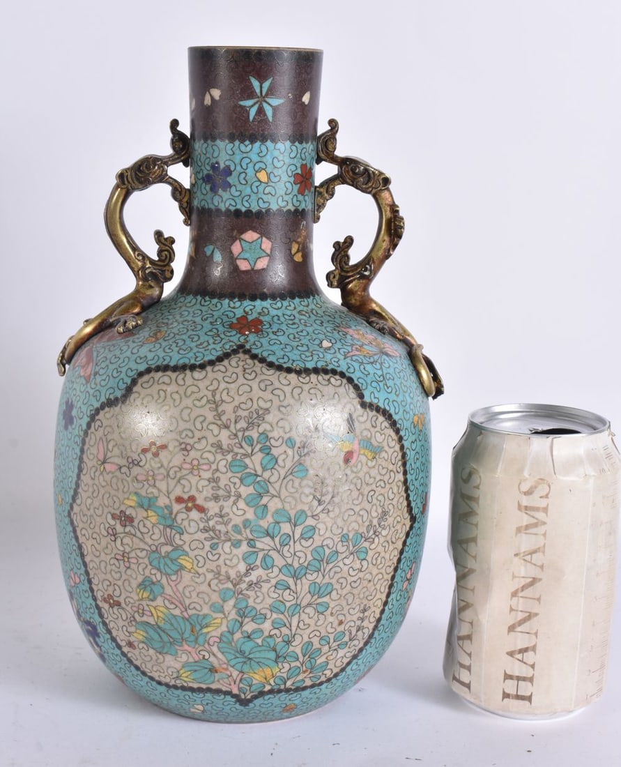 AN UNUSUAL 19TH CENTURY JAPANESE MEIJI PERIOD CLOISONNE ENAMEL OVERLAID VASE with stylised bronze ha: AN UNUSUAL 19TH CENTURY JAPANESE MEIJI PERIOD CLOISONNE ENAMEL OVERLAID VASE with stylised bronze handles. 26cm x 12 cm.