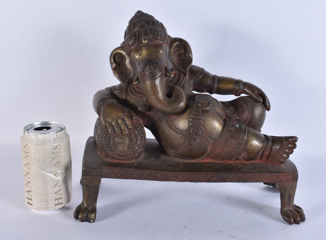 A LOVELY LARGE 19TH CENTURY INDIAN BRONZE HINDU FIGURE OF GANESHA modelled reclining. 28cm x 28cm x (1 of 20)