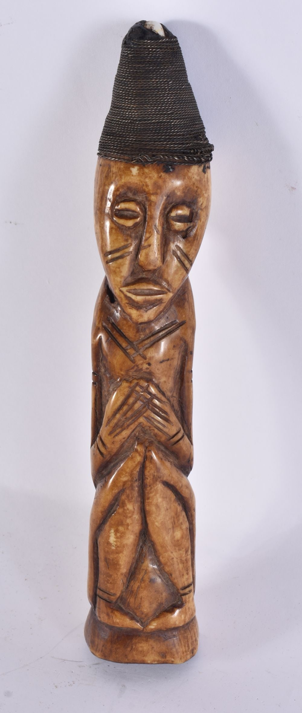 AN AFRICAN TRIBAL LUBA CARVED BONE FIGURE. 24.5 cm high. (1 of 7)