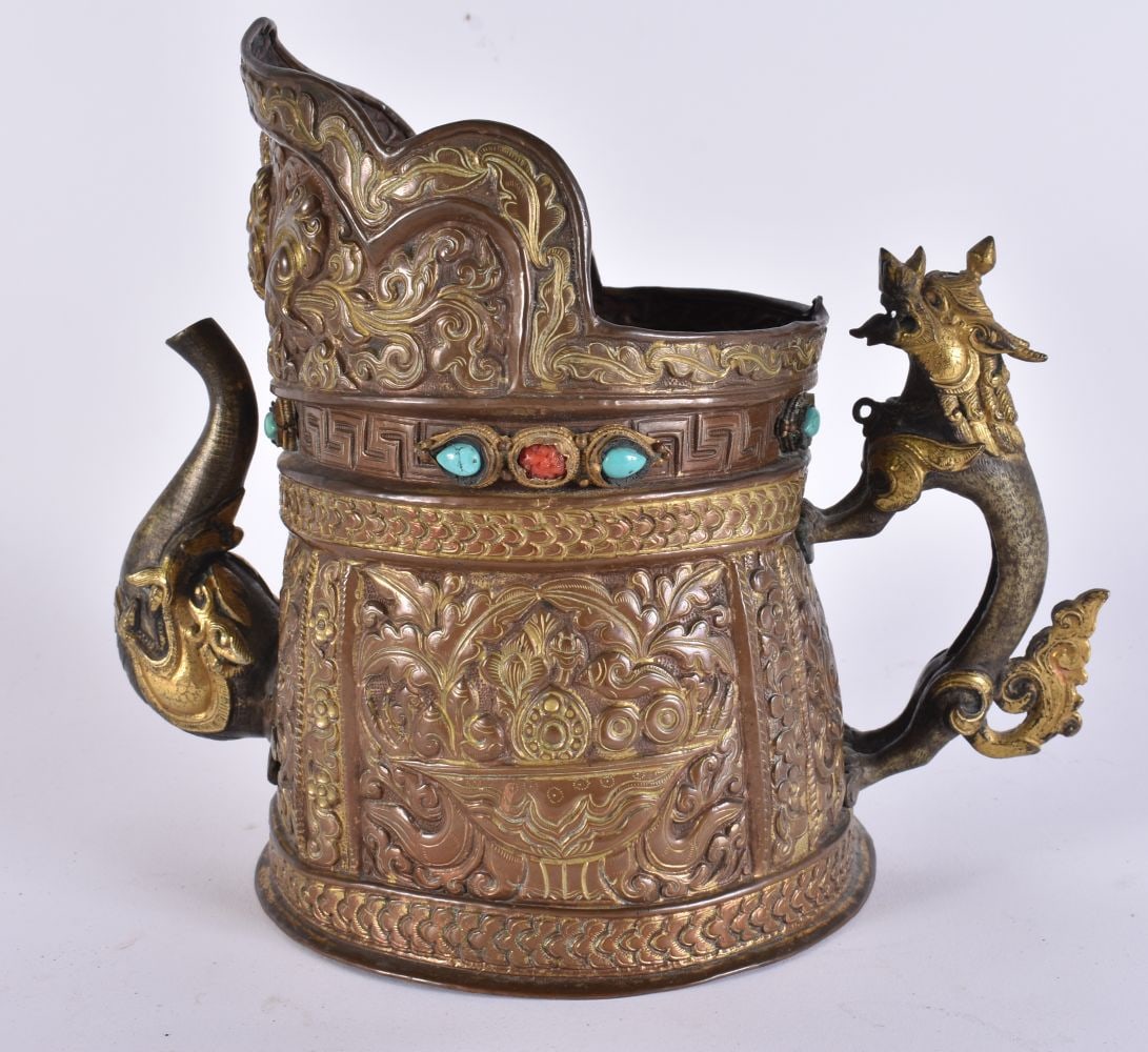 A 17TH/18TH CENTURY TIBETAN MONK'S CAP EWER inset with coral and turquoise. 20cm x 14 cm.: A 17TH/18TH CENTURY TIBETAN MONK'S CAP EWER inset with coral and turquoise. 20cm x 14 cm.