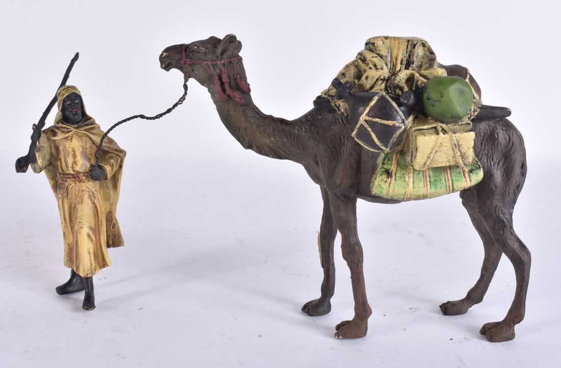 A CONTINENTAL COLD PAINTED BRONZE ARAB MALE & CAMEL. 15 cm x 12 cm.: A CONTINENTAL COLD PAINTED BRONZE ARAB MALE & CAMEL. 15 cm x 12 cm.