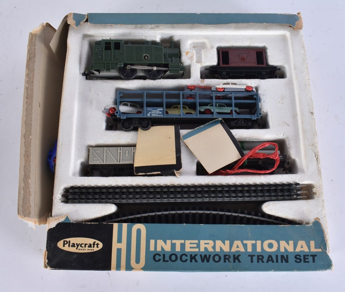 A PLAYCRAFT INTERNATIONAL CLOCKWORK TRAIN SET. (qty) (1 of 4)