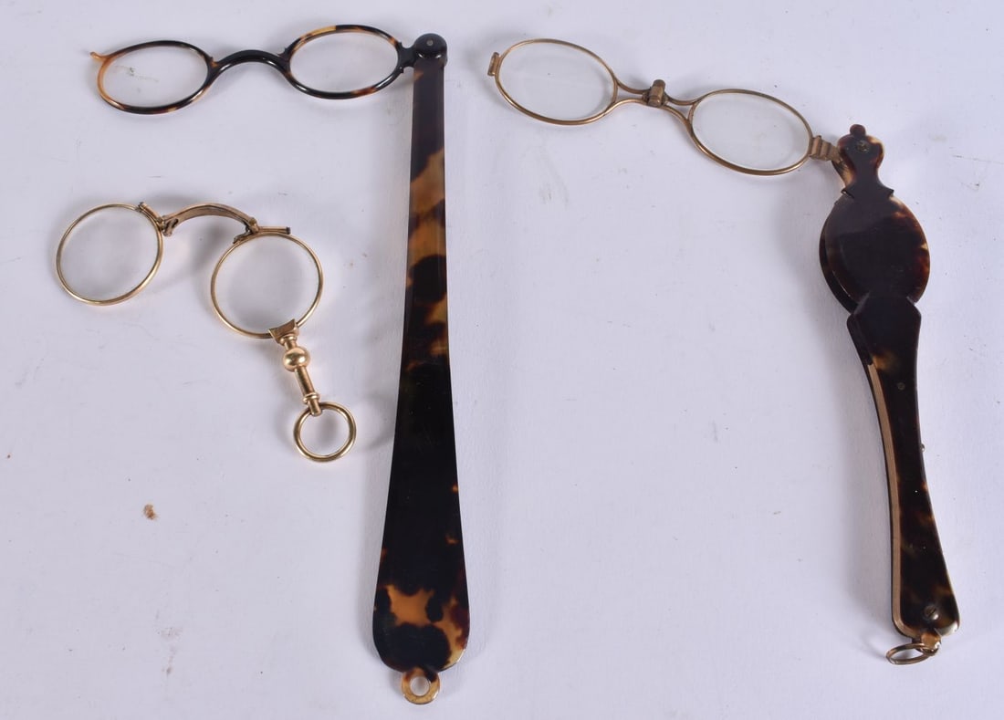 TWO PAIRS OF TORTOISESHELL LORGNETTES together with another pair. Largest 29 cm long extended. (3) (1 of 4)
