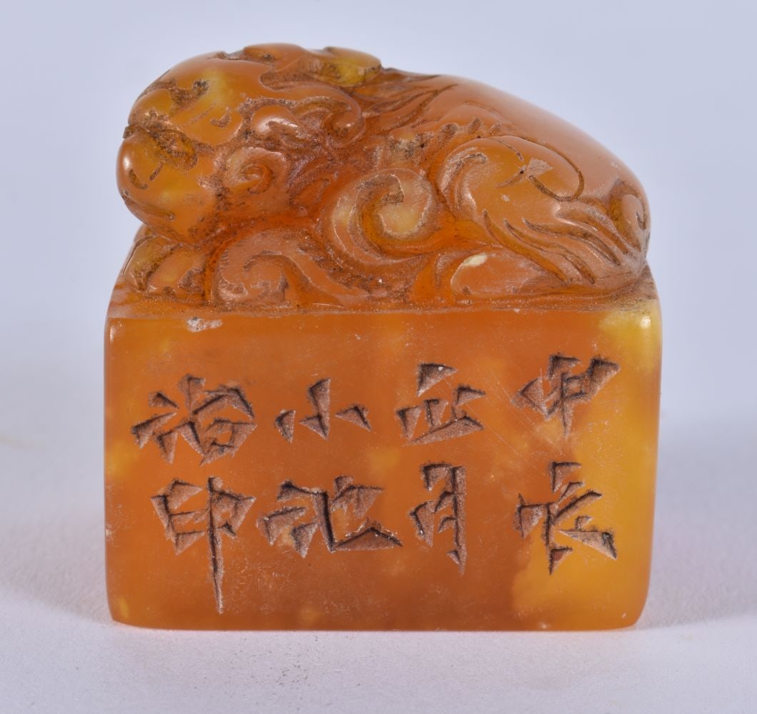 A CHINESE CARVED ORANGE SOAPSTONE BEAST SEAL possibly 19th century. 3.5 cm x 3.25cm.: A CHINESE CARVED ORANGE SOAPSTONE BEAST SEAL possibly 19th century. 3.5 cm x 3.25cm.