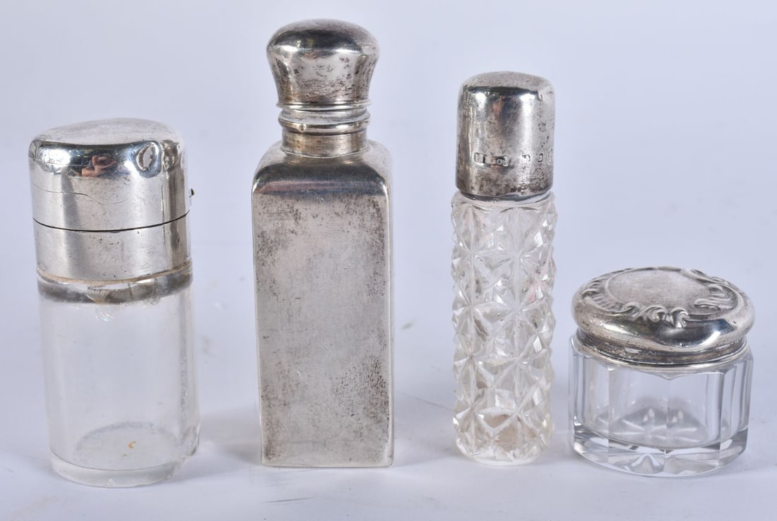 FOUR ANTIQUE SILVER MOUNTED GLASS SCENT BOTTLES. Largest 6.75 cm high. (4) (1 of 6)