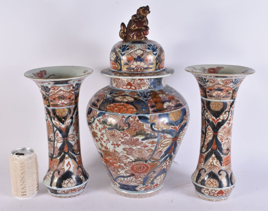 A 17TH/18TH CENTURY JAPANESE EDO PERIOD IMARI PORCELAIN GARNITURE painted with birds and foliage. La: A 17TH/18TH CENTURY JAPANESE EDO PERIOD IMARI PORCELAIN GARNITURE painted with birds and foliage. Largest 45cm x 20cm. (3)