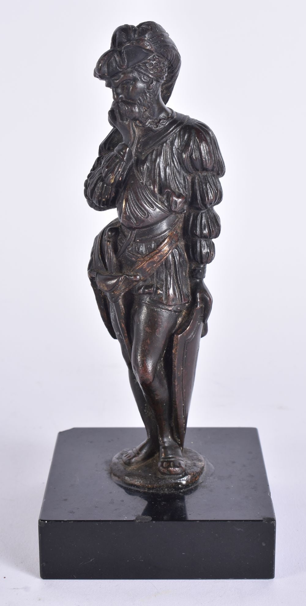 A 17TH/18TH CENTURY BRONZE FIGURE OF A RENAISSANCE MALE modelled holding his moustache. 17.5 cm high: A 17TH/18TH CENTURY BRONZE FIGURE OF A RENAISSANCE MALE modelled holding his moustache. 17.5 cm high.