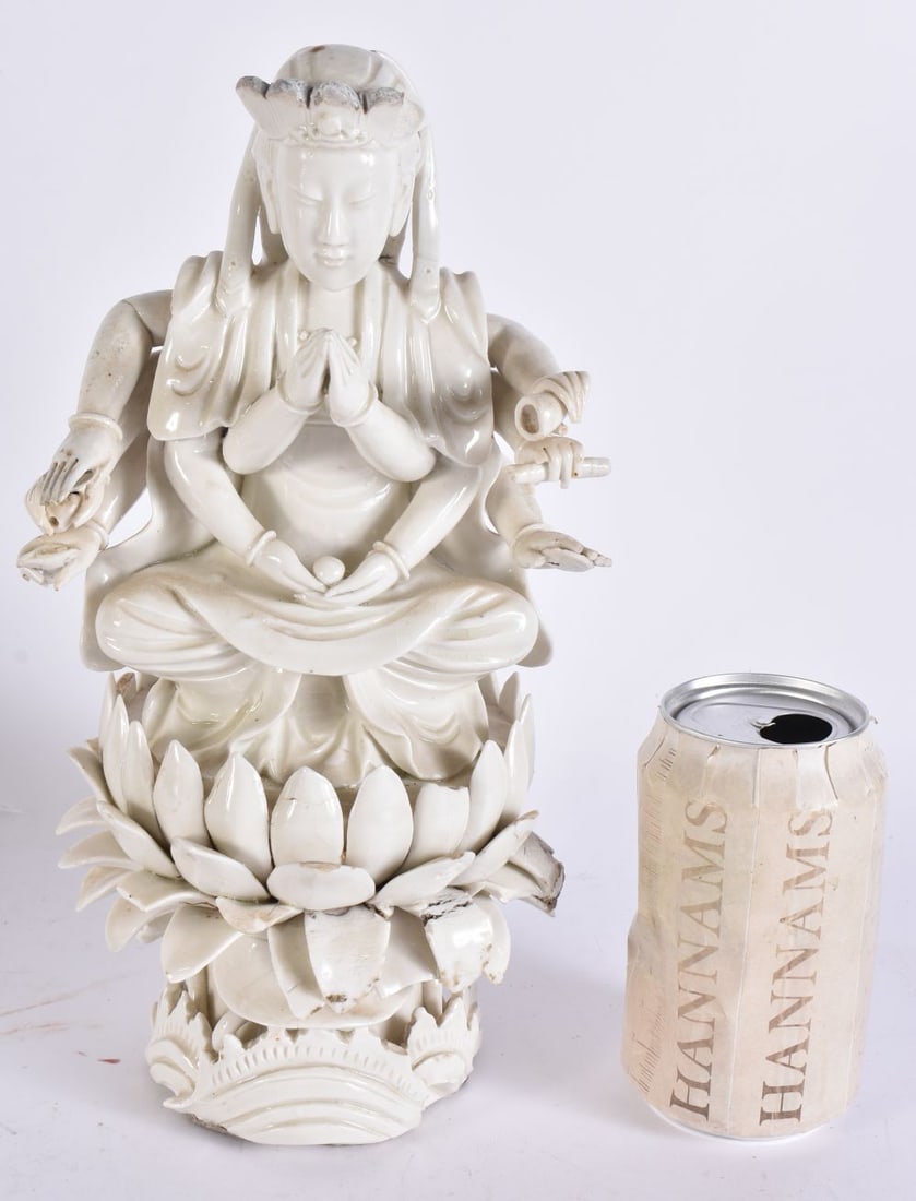 A LARGE CHINESE QING DYNASTY BLANC DE CHINE PORCELAIN MULTI ARMED IMMORTAL. 29 cm high.: A LARGE CHINESE QING DYNASTY BLANC DE CHINE PORCELAIN MULTI ARMED IMMORTAL. 29 cm high.