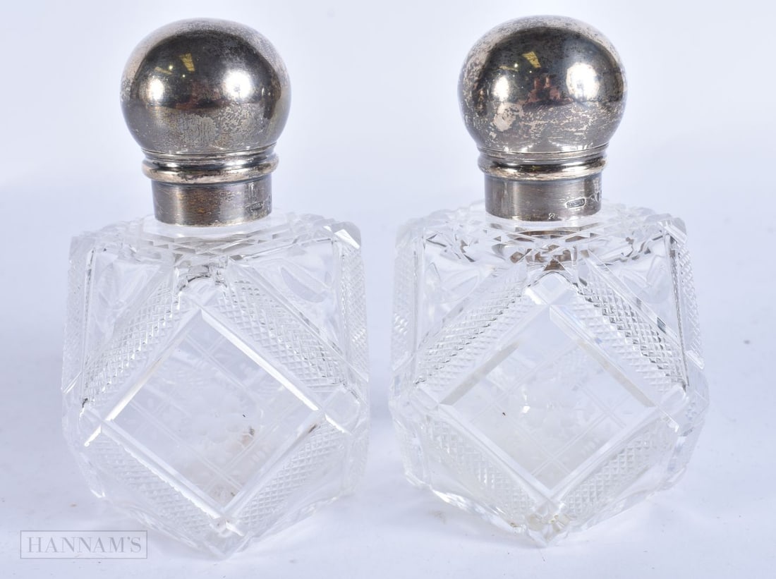 A PAIR OF ANTIQUE SILVER AND CUT GLASS SCENT BOTTLES. 12 cm high. (1 of 5)