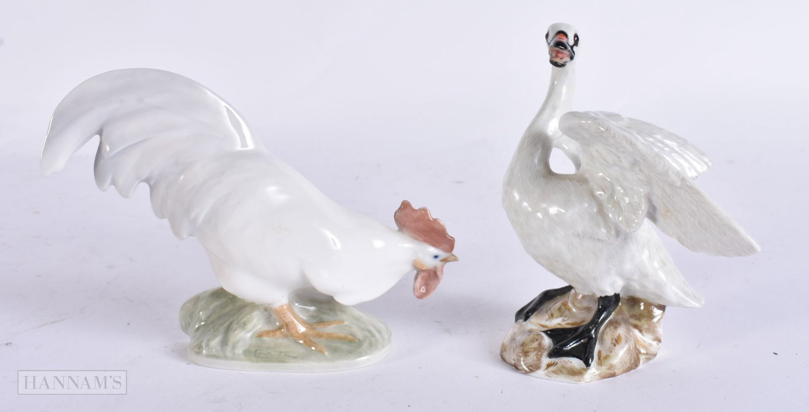 A MEISSEN FIGURE OF A SWAN together with a Danish Copenhagen hen. Largest 12.5 cm wide. (2): A MEISSEN FIGURE OF A SWAN together with a Danish Copenhagen hen. Largest 12.5 cm wide. (2)
