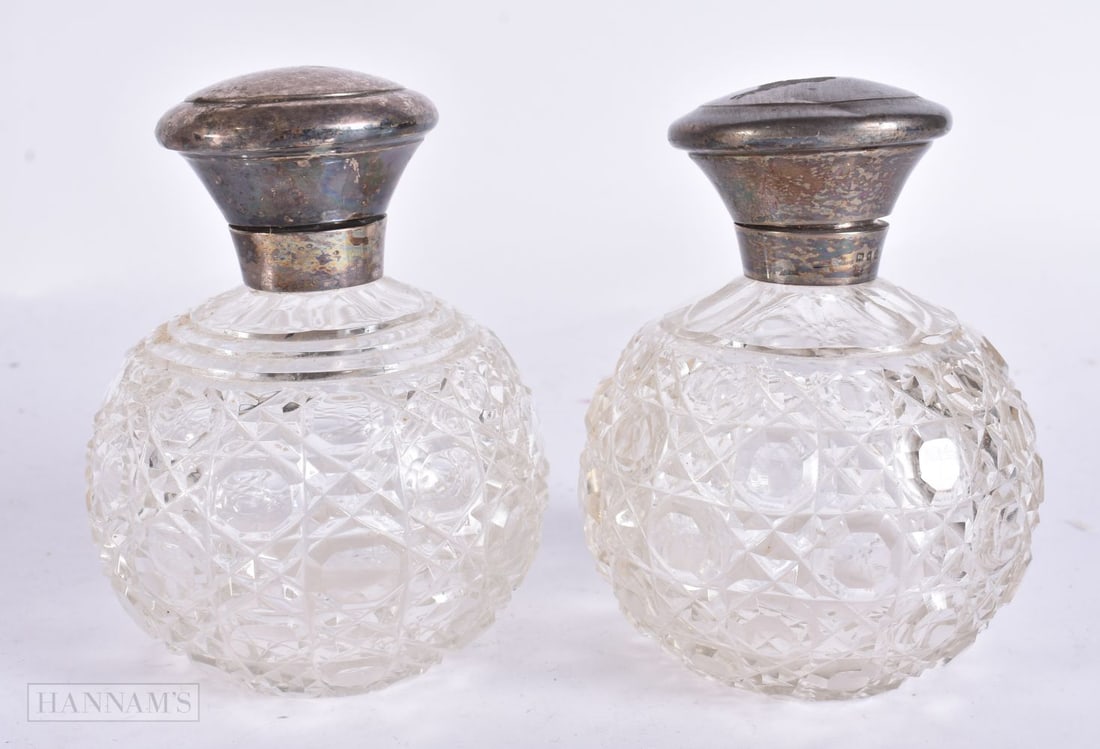 A PAIR OF ANTIQUE SILVER AND CUT GLASS SCENT BOTTLES. 12 cm high. (1 of 5)