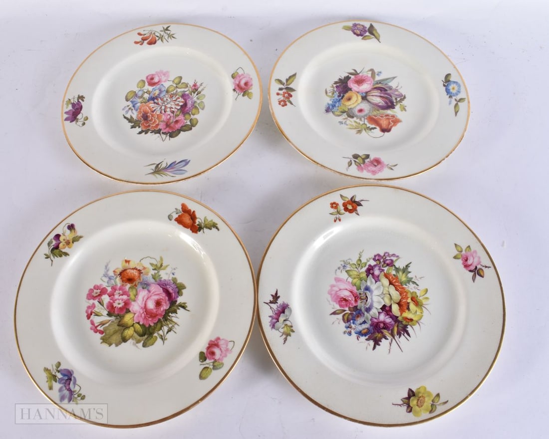 A SET OF FOUR EARLY 19TH CENTURY DERBY PORCELAIN PLATES painted with flowers. 24.5 cm wide.: A SET OF FOUR EARLY 19TH CENTURY DERBY PORCELAIN PLATES painted with flowers. 24.5 cm wide.
