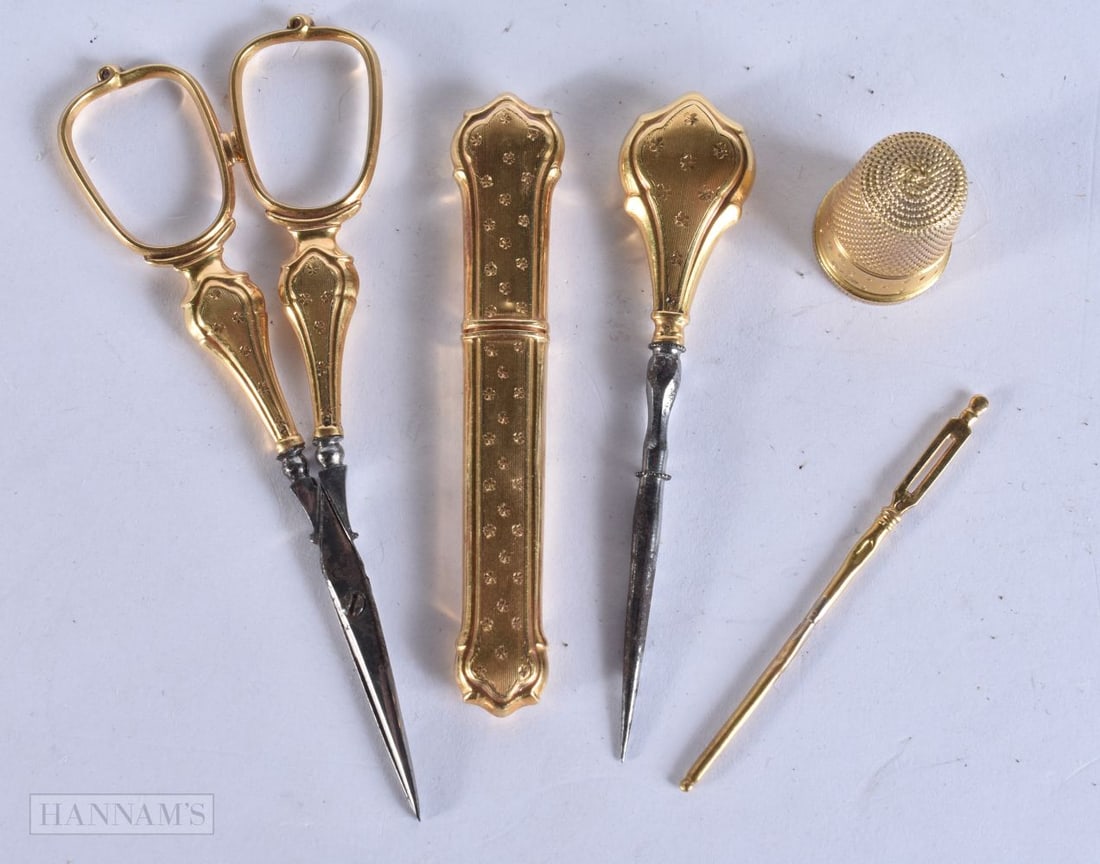 FOUR EARLY 19TH CENTURY 18CT GOLD ETUI TOOLS together with a yellow metal thimble. Case and scoop 8 (1 of 6)