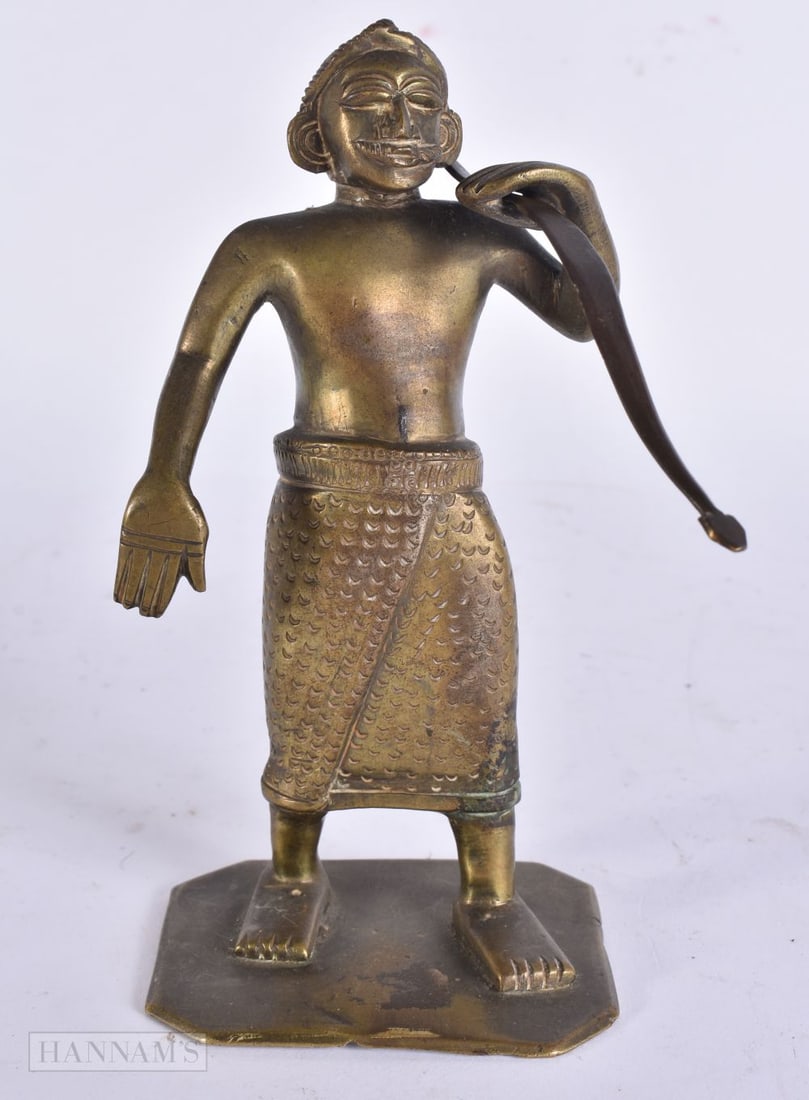 A 19TH CENTURY INDIAN BRONZE FIGURE OF A MALE GUARDIAN modelled holding a bow. 17.5 cm high. (1 of 5)
