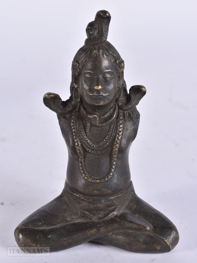 AN UNUSUAL 19TH CENTURY INDIAN HINDU BRONZE FIGURE OF A DEITY modelled armless with serpents. 10 cm (1 of 4)