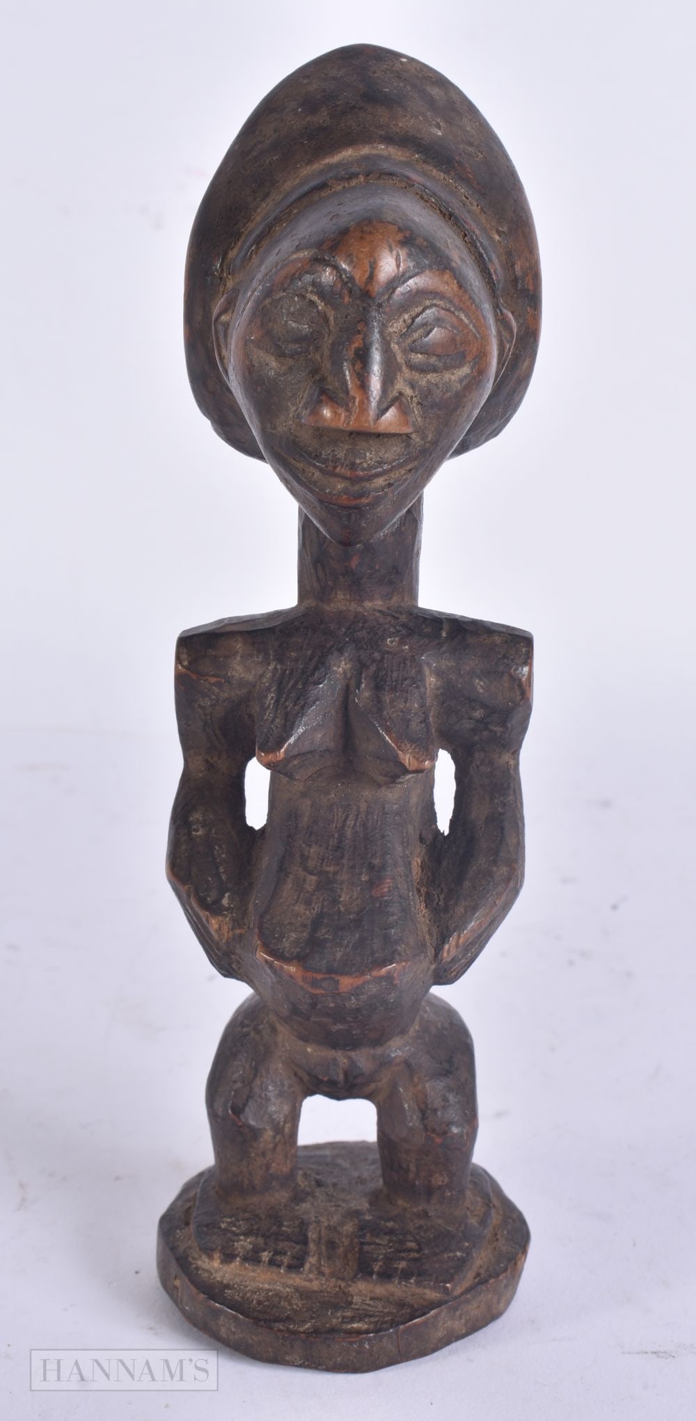 AN AFRICAN TRIBAL CARVED WOOD FERTILITY FIGURE. 17.5 cm high. (1 of 5)